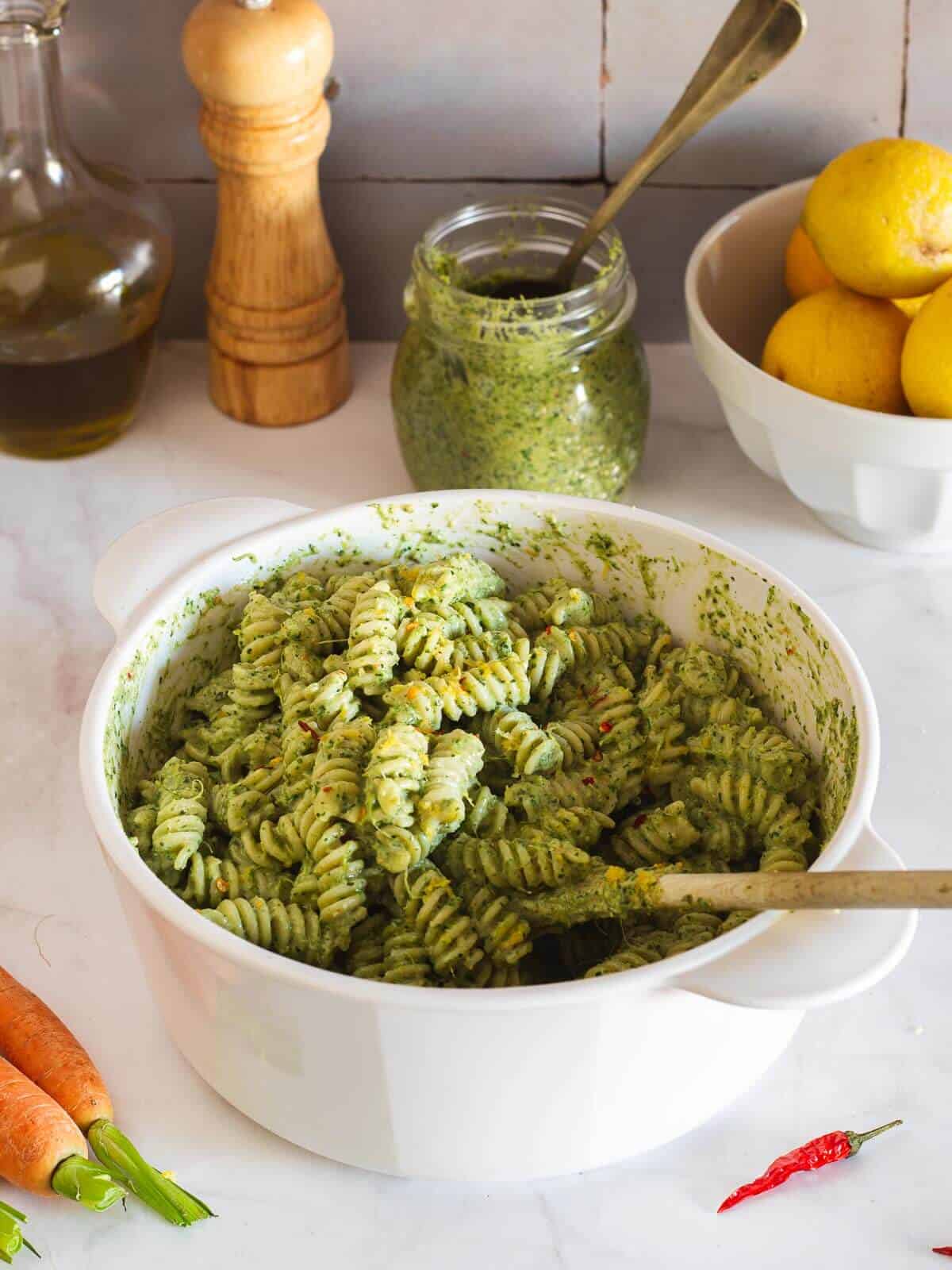 stirring pasta salad