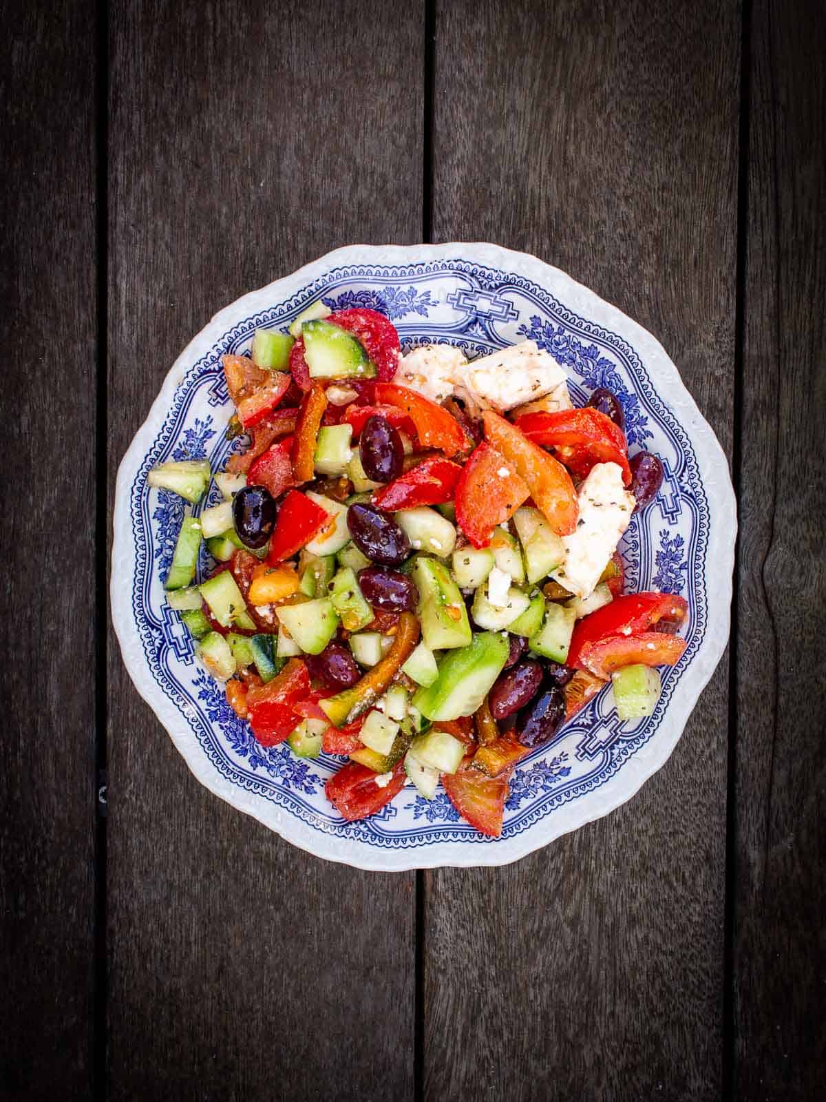 Vegan Greek Salad in wood table.