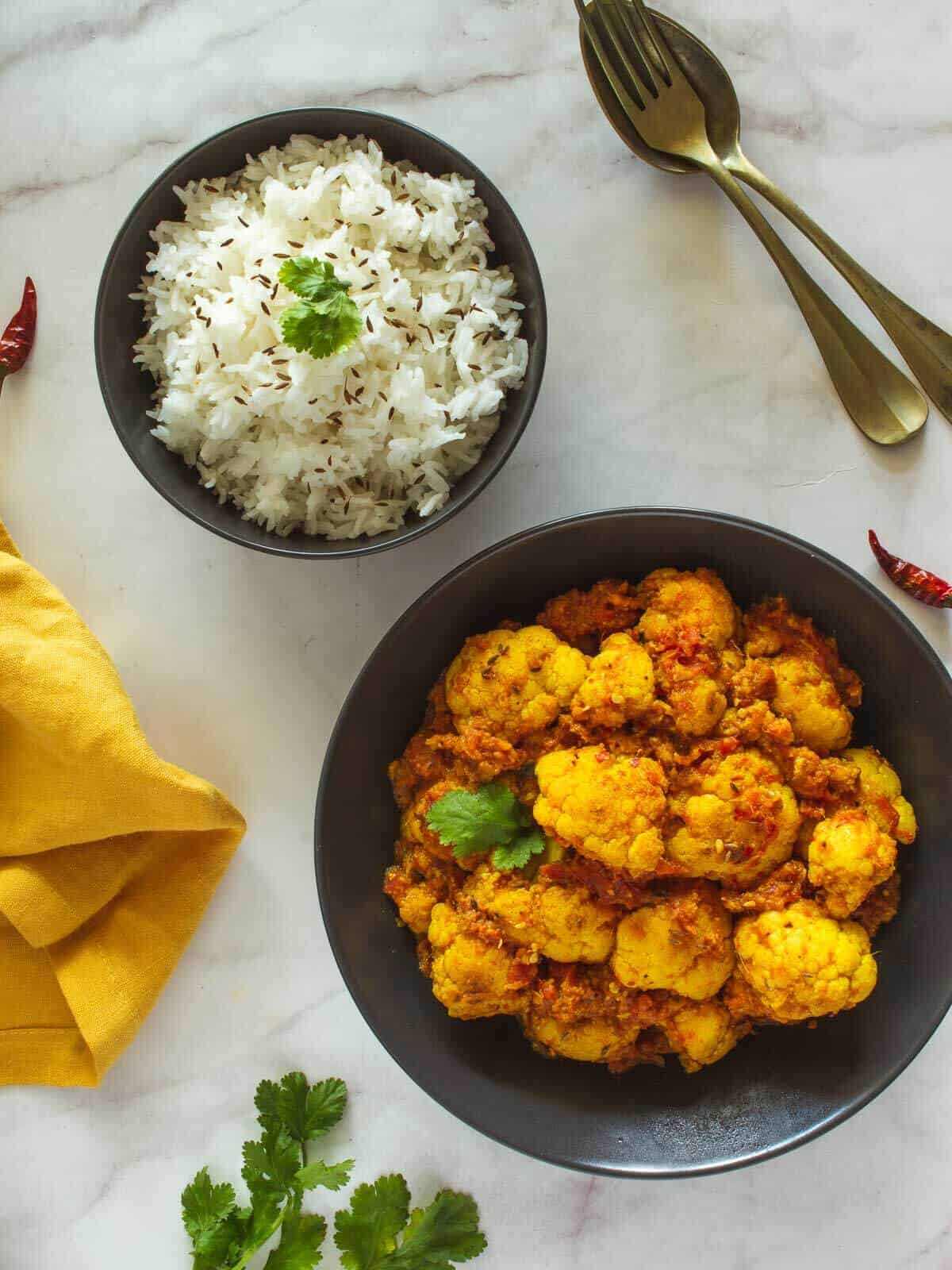 cauliflower vegan curry plated with basmati rice.