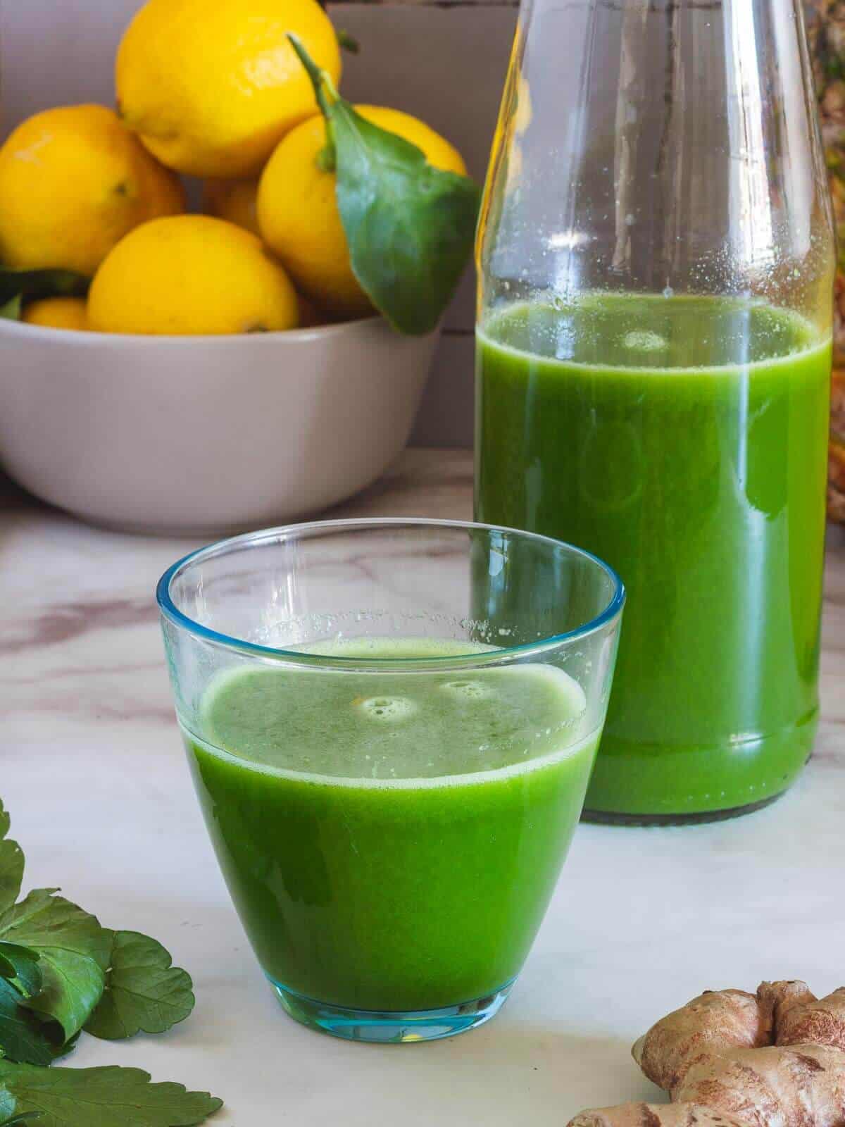 green juice served next to a half empty bottle.