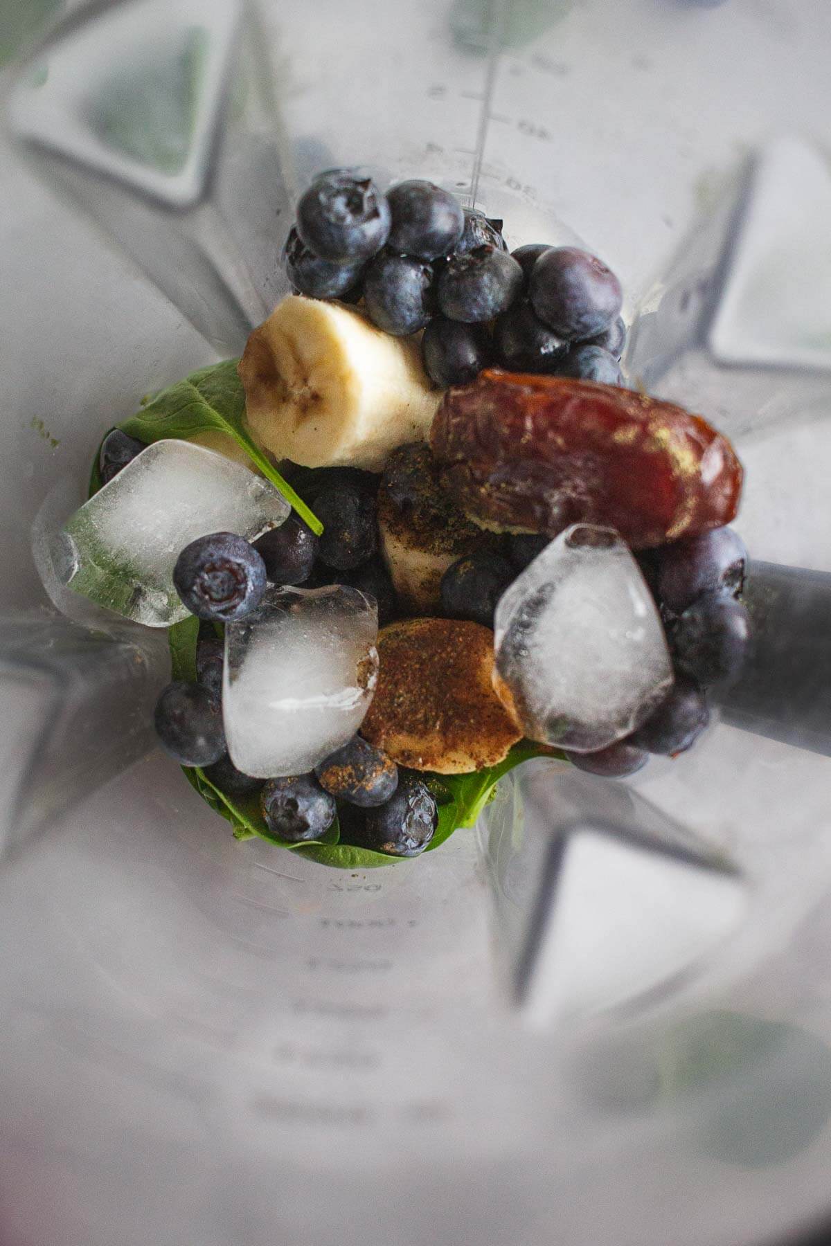 Spinach Blueberry Banana Smoothie ingredients in blender jar before mixing