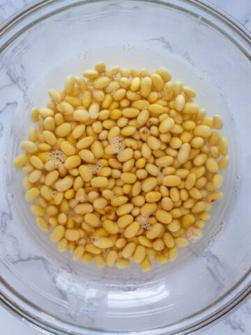 soaking soybeans in a bowl with water.