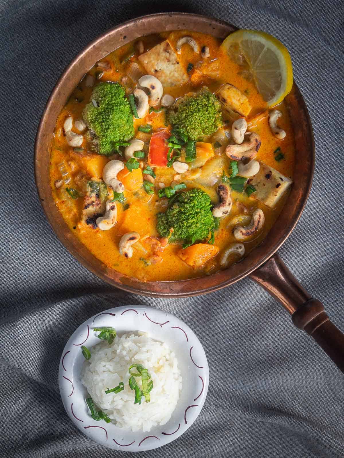 vegan Thai Red Curry served with a bowl of steamed Jasmine Rice