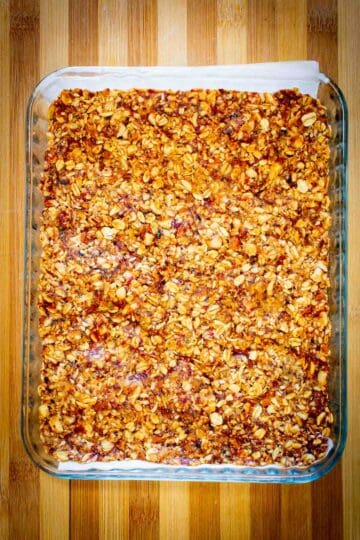 pressed granola mix in a baking sheet.
