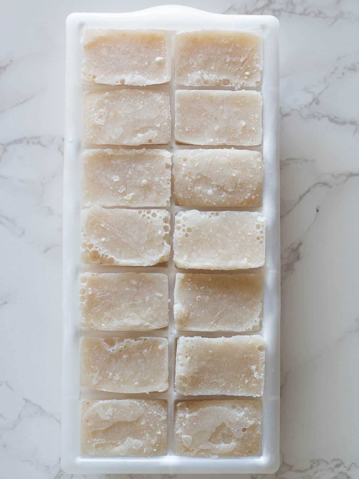 frozen plant milk in an ice cube tray.