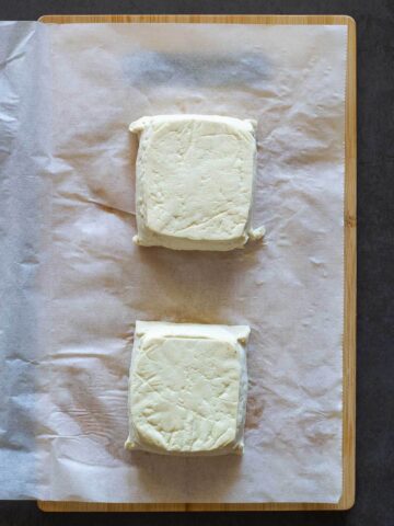 Pressing Tofu in lined parchment paper