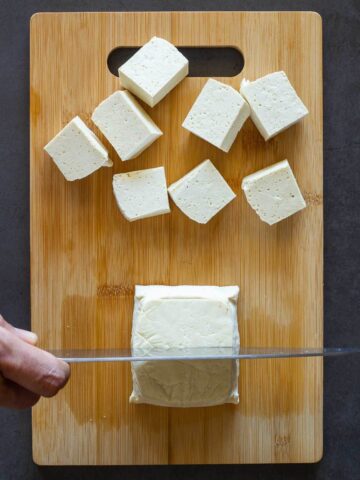 dicing extra firm Tofu.