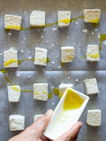 drizzle the pressed tofu cubes with your oil.