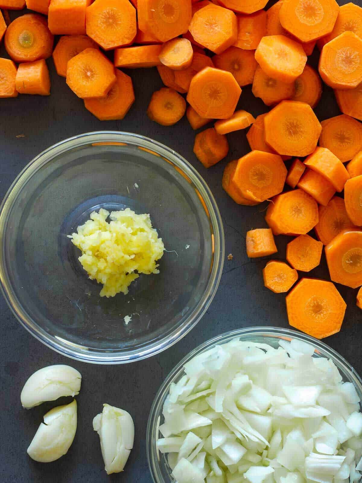 Chopped carrots, onions, garlic, and minced ginger.