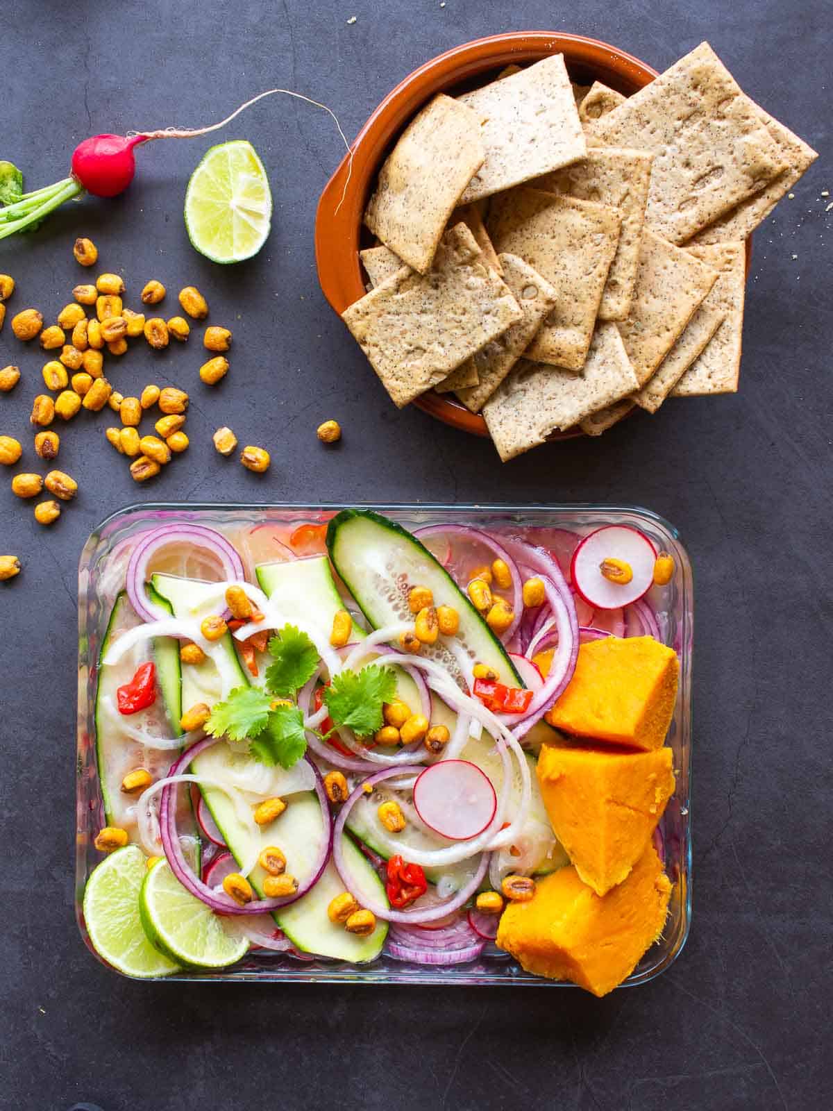 Veggie Ceviche served with crackers and corn kernels