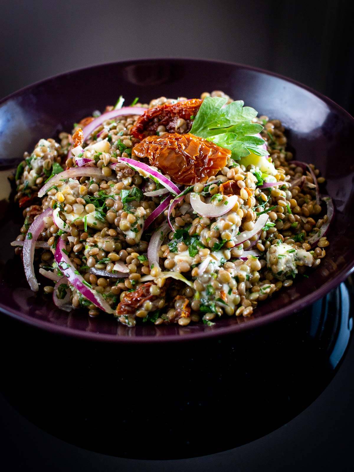 Mediterranean lentil salad served on a plate.