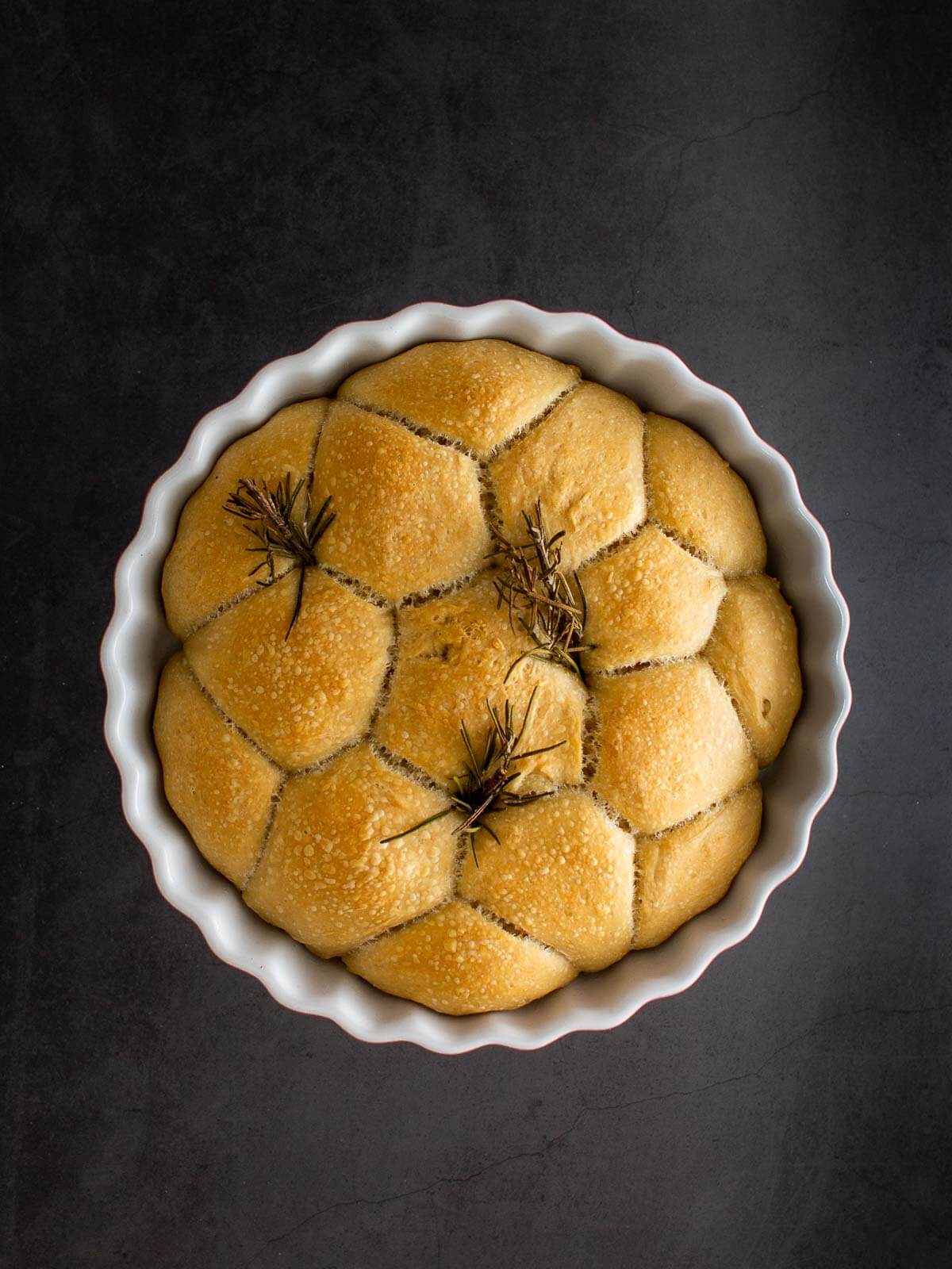 perfectly baked bread buns in baking dish.