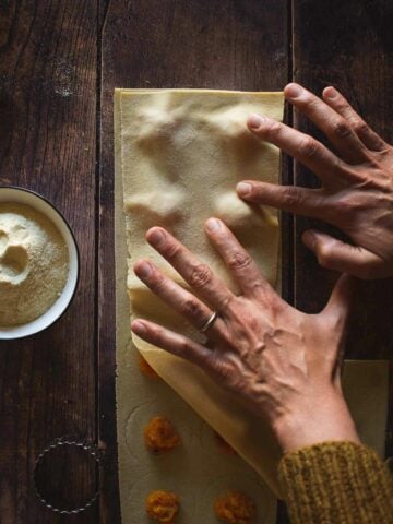 cover the second pasta sheet and press with your fingers to remove air pockets