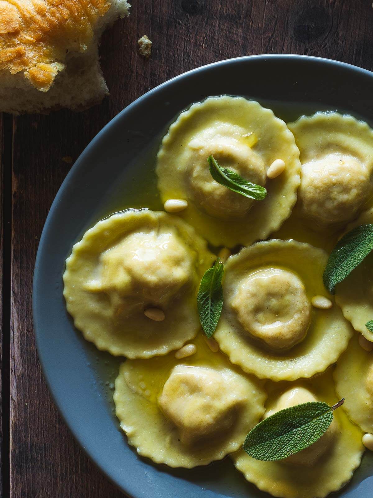 vegan butternut squash ravioli served with toasted pine nuts and sage