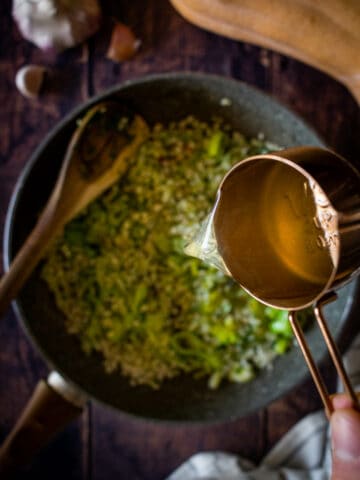 add vegetable stock, one cup at a time.