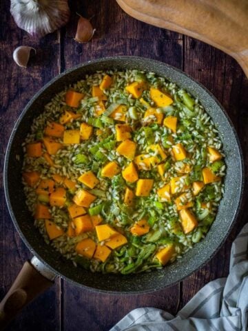 add cubed butternut squash on top of the rice with leeks.