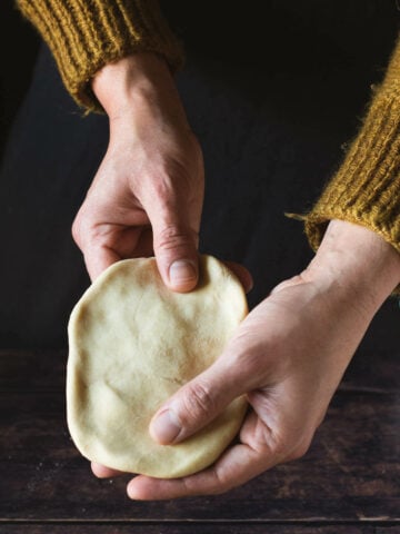 stretch the homemade pasta dough with your hands