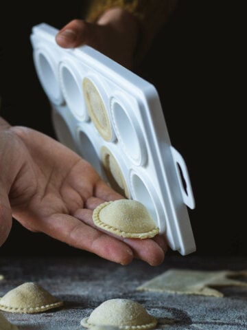 turn the pasta tray upside down, and remove each ravioli with care