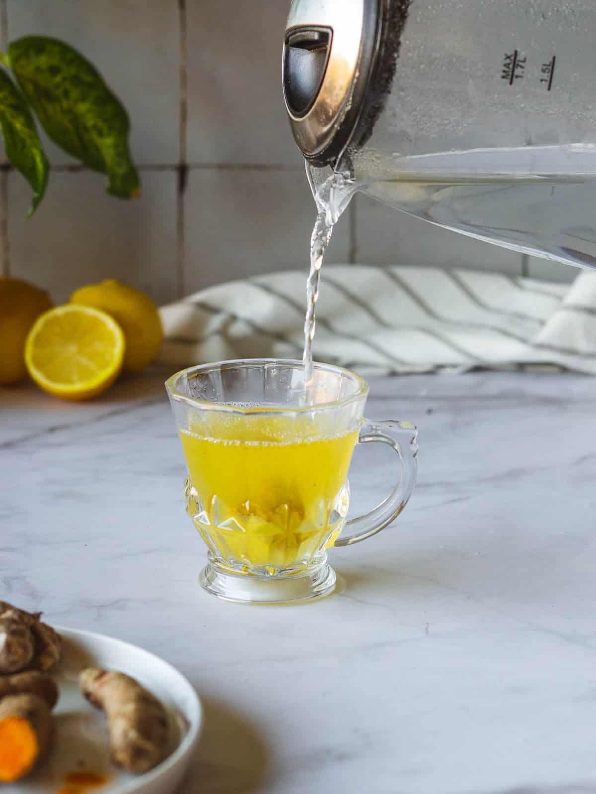 add water to a cup with the fresh roots and spices