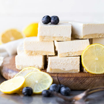 no bake lemon bars decorated with blueberries and halved lemons