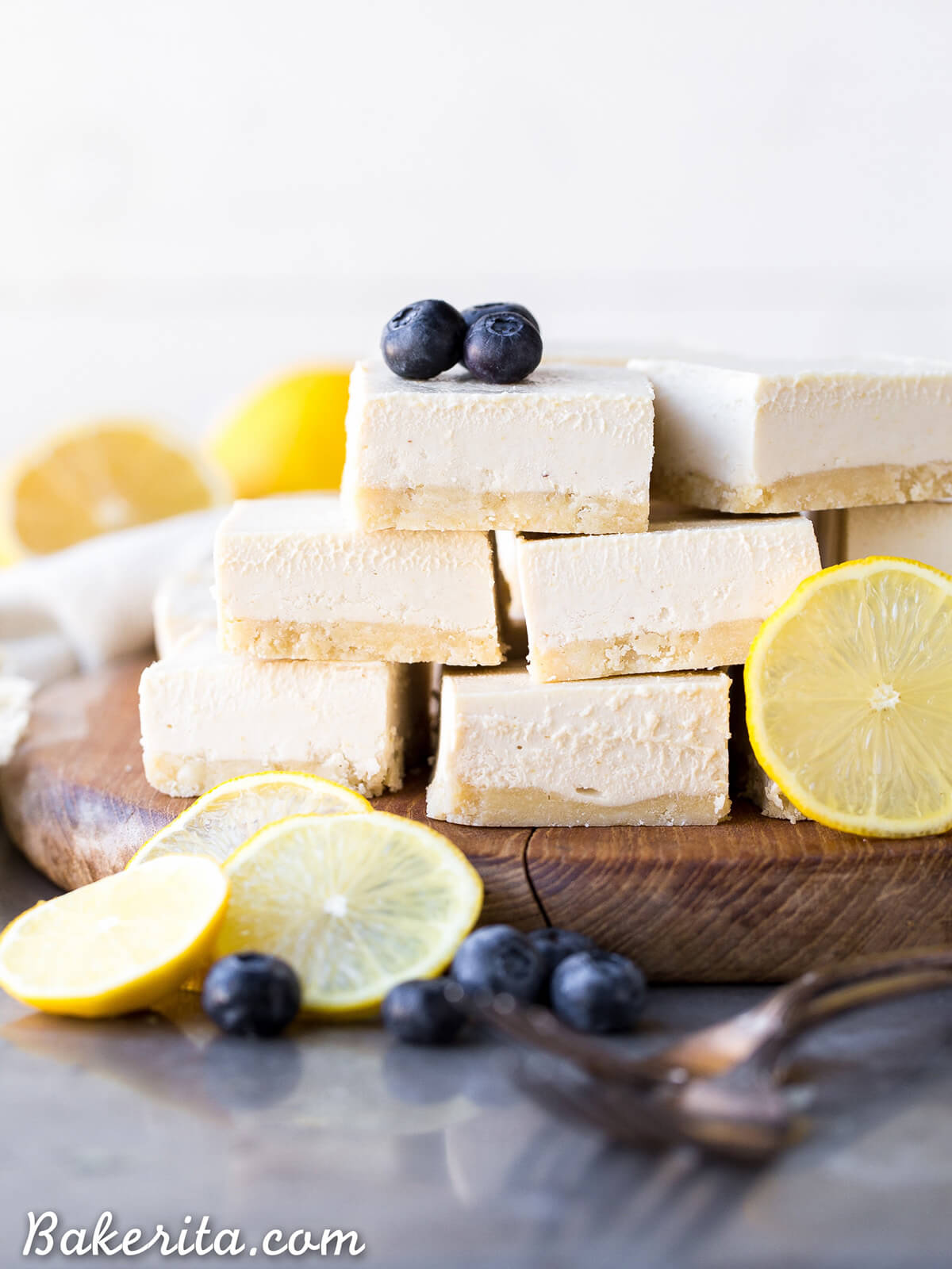 no bake lemon bars decorated with blueberries and halved lemons