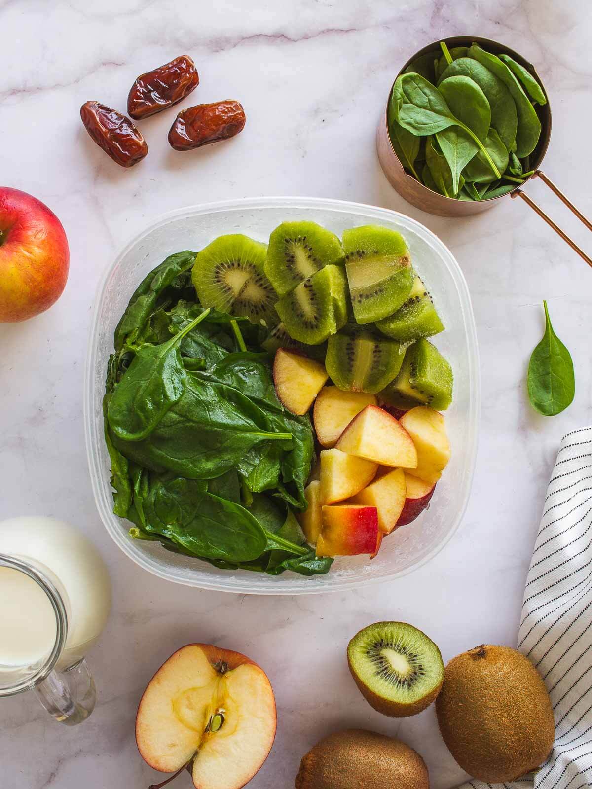 portioned frozen spinach, apples and kiwi fruit