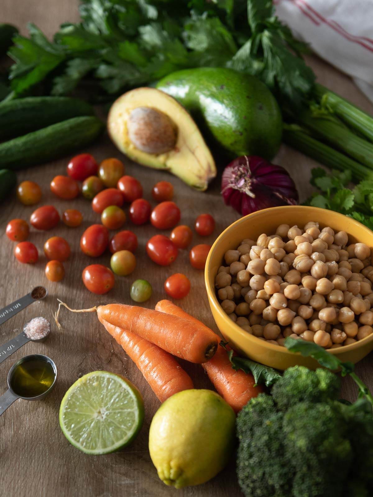 vegan chickpea salad ingredients in a wooden table