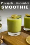 Pineapple Cucumber Smoothie served in two glasses topped with pineapple chunks and cucumber smoothie pin