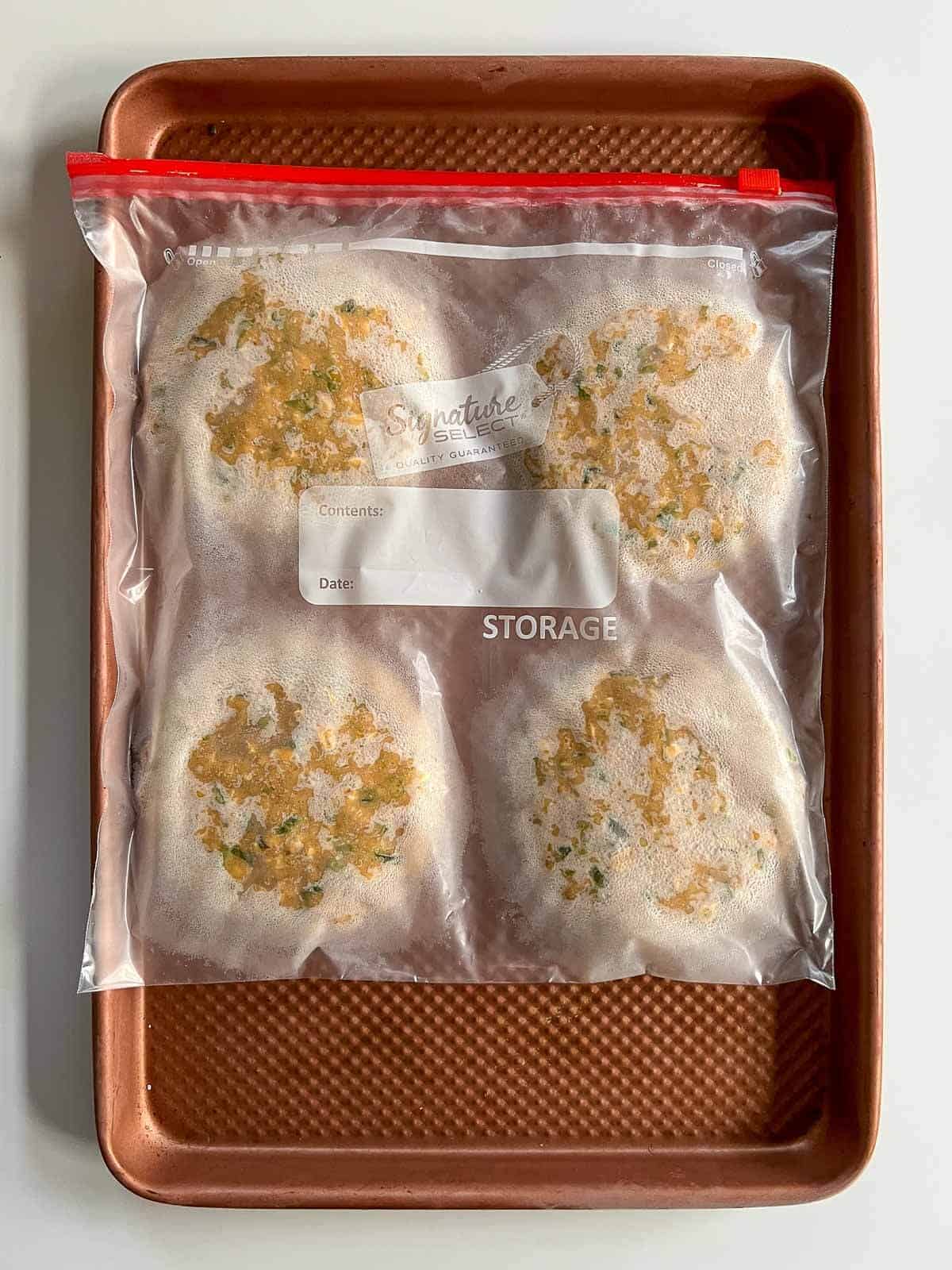 frozen chickpea burgers stored in the freezer in a plastic bag.