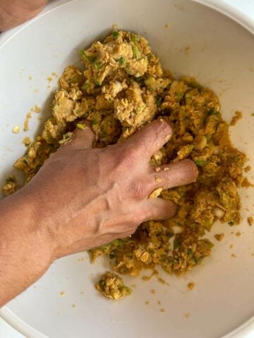 mixing all the ingredients with my hands in a large bowl.