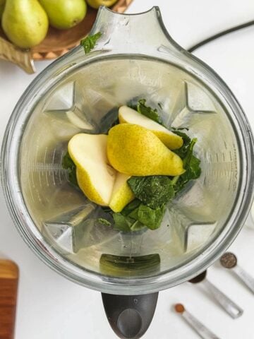 smoothie ingredients inside of a high-speed blender.