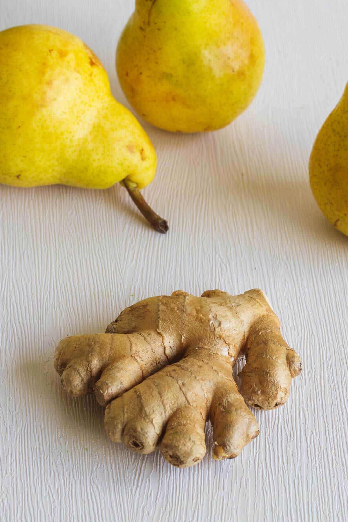 pears and ginger root on a table.