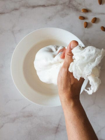 squeeze all the almond milk out and return it to the blender