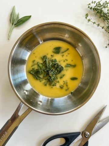 skillet with melted vegan butter and sage.