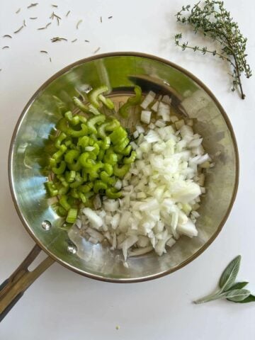 sautéing chopped celery and onions in a skillet. 