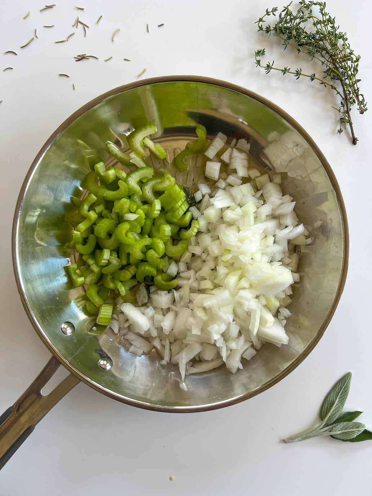 chopped onions and celery in a large skillet with butter.