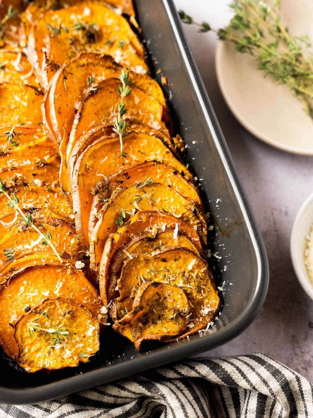 roasted sweet potato slices in bakin dish.