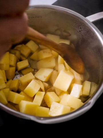 add dice potatoes into the saucepan.
