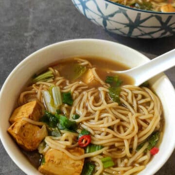 Chinese Tofu and noodles soup served in a bowl.