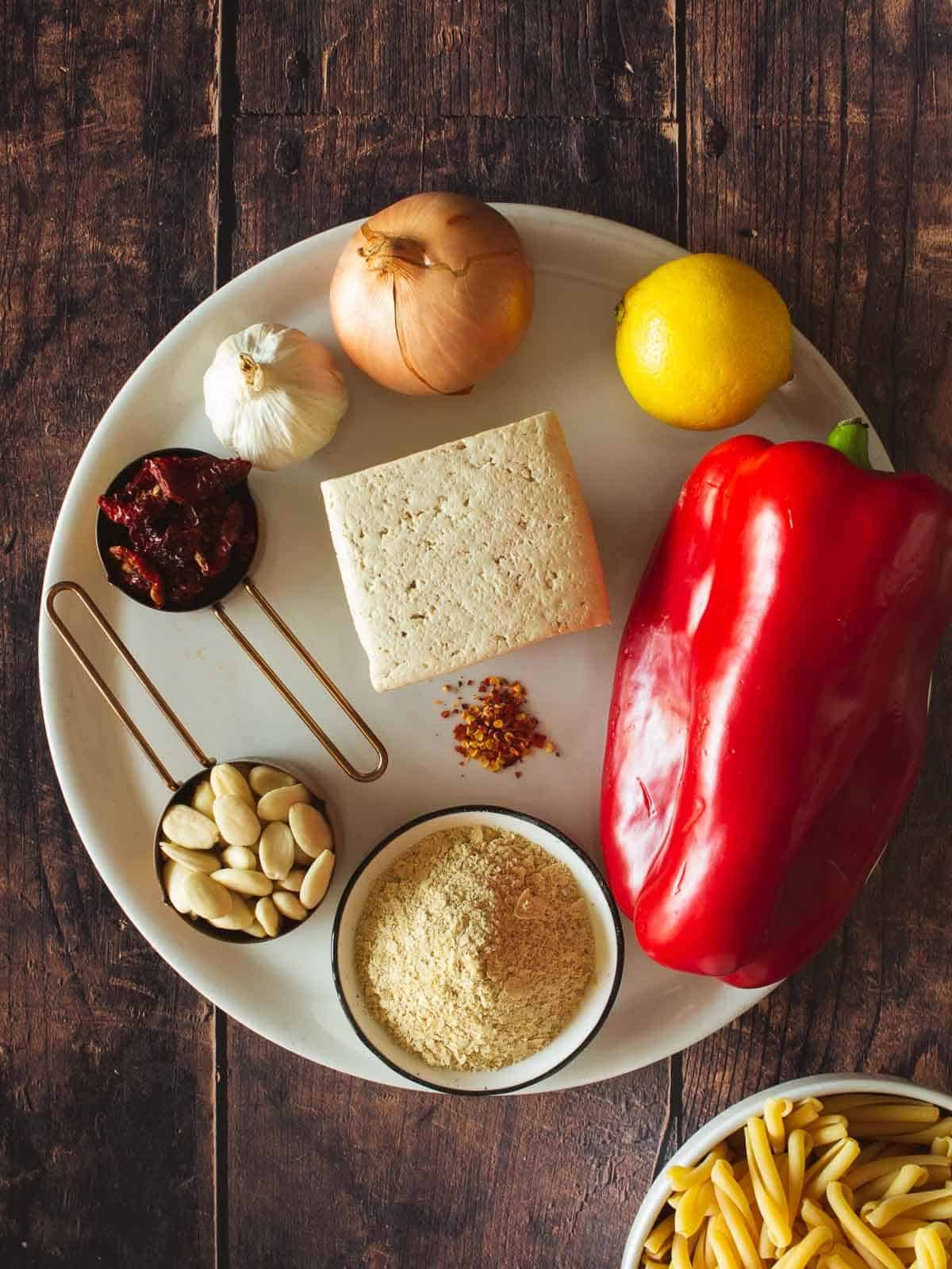 tofu pesto ingredients on a white plate.