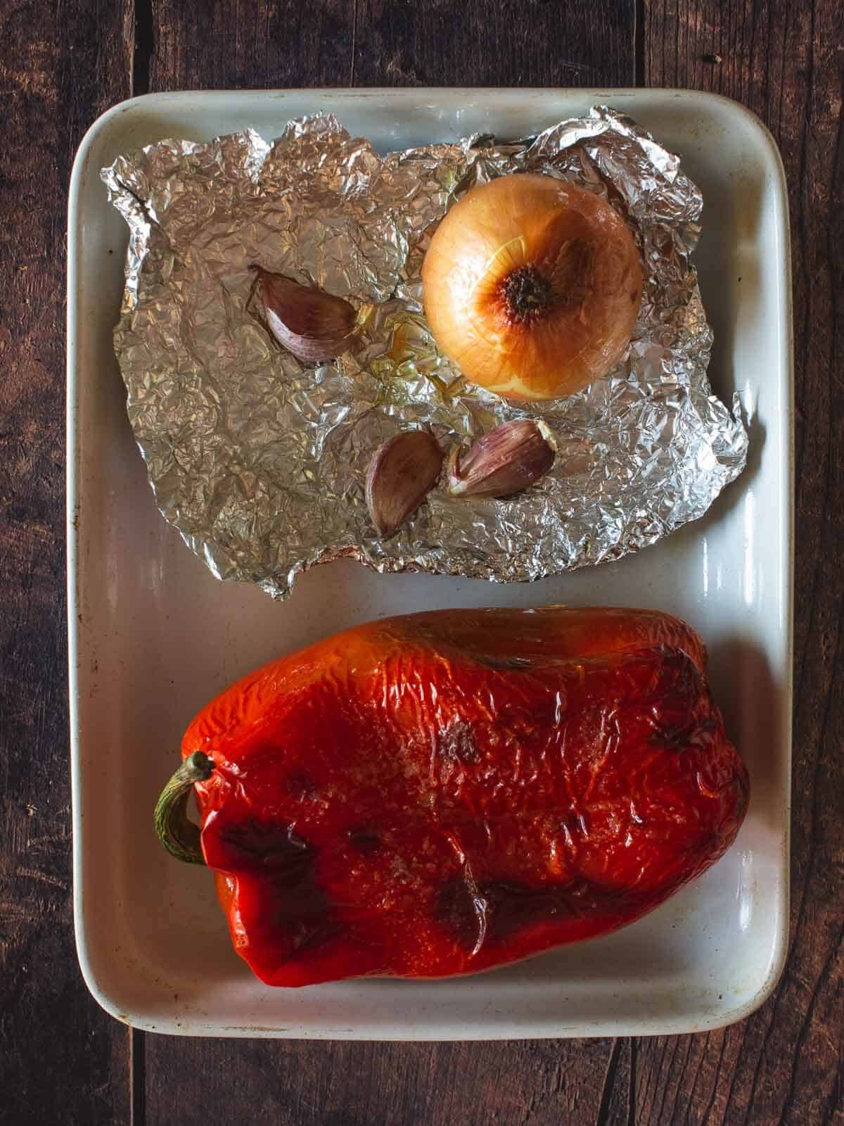 roasted red pepper, onion, and garlic in aluminium foil.