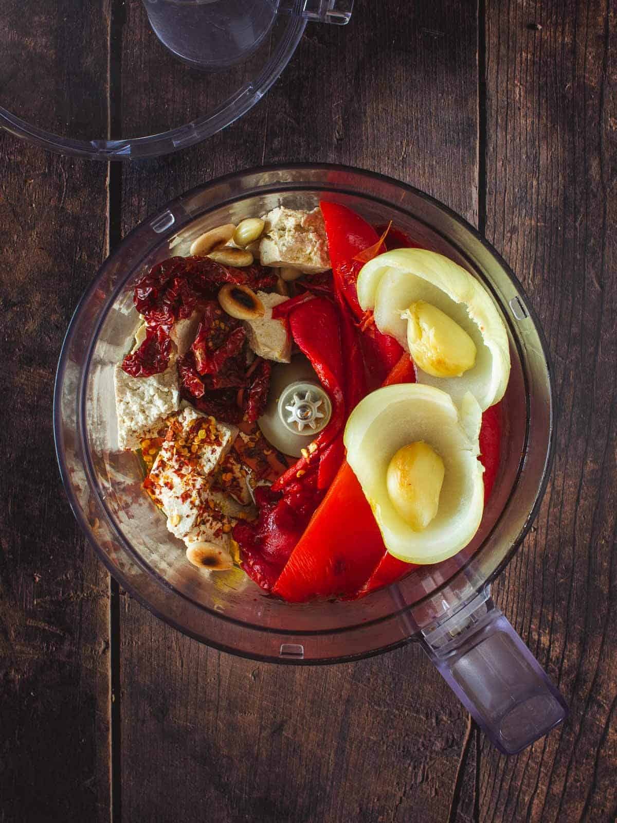 all ingredients in a food processor vase before blending.