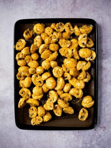 Put the mushrooms on a non-stick or lined baking sheet and bake.