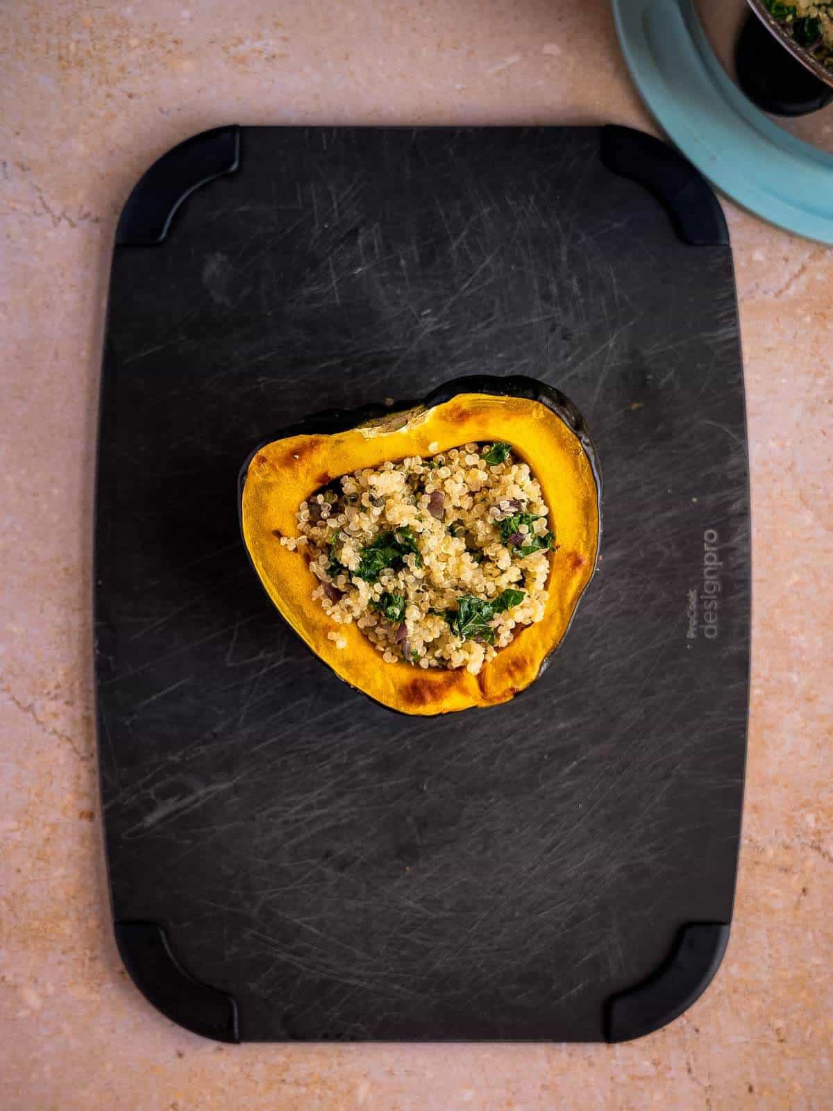 stuff the cooked acorn squash with the quinoa mixture.
