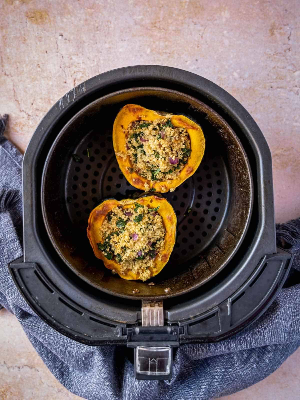 put the stuffed acorn squash back into the air fryer.