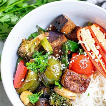 kung pao tofu recipe served in a bowl with steamed rice.