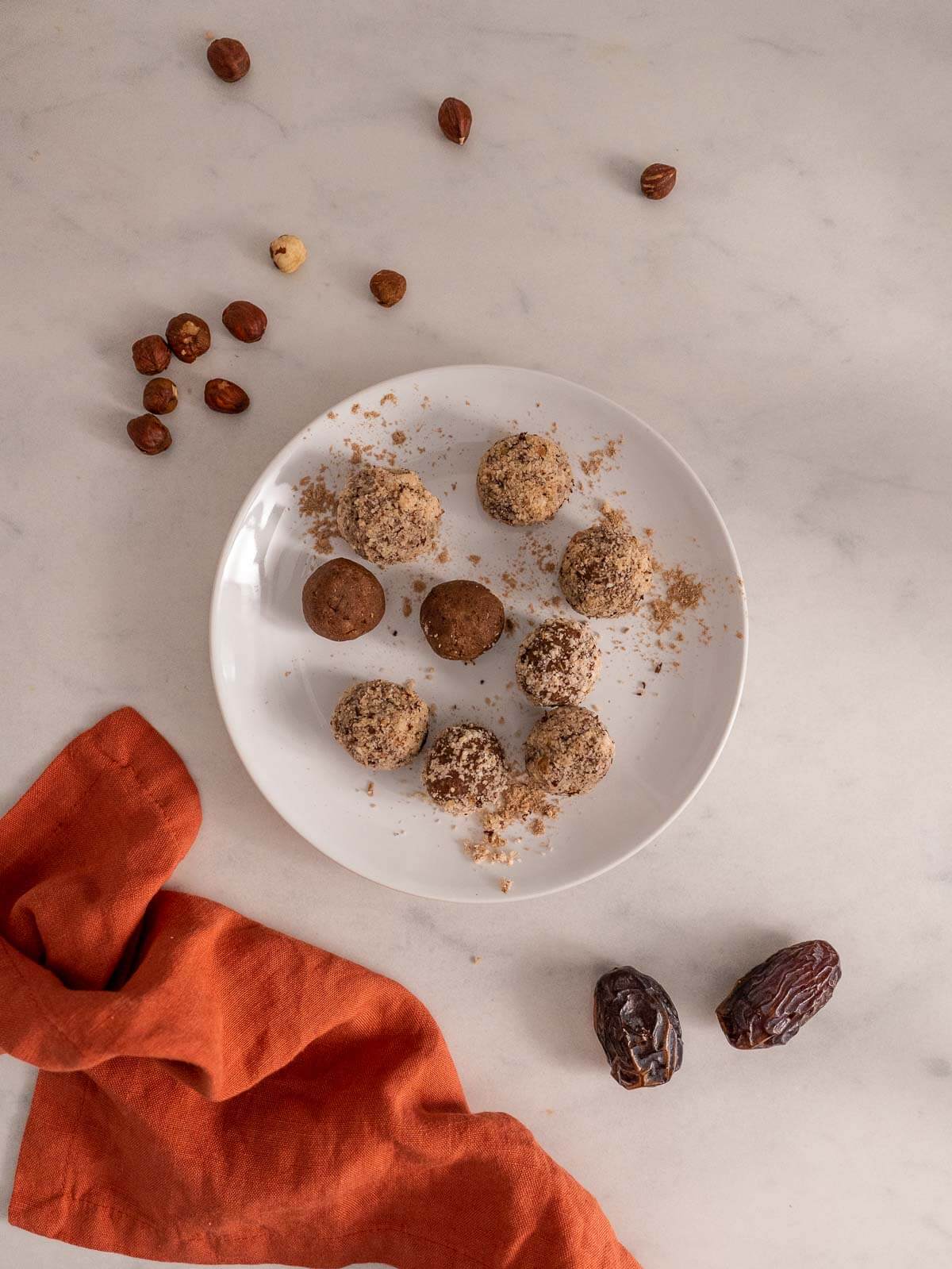 optionally roll the vegan protein balls over additional almond pulp or coconut flakes.