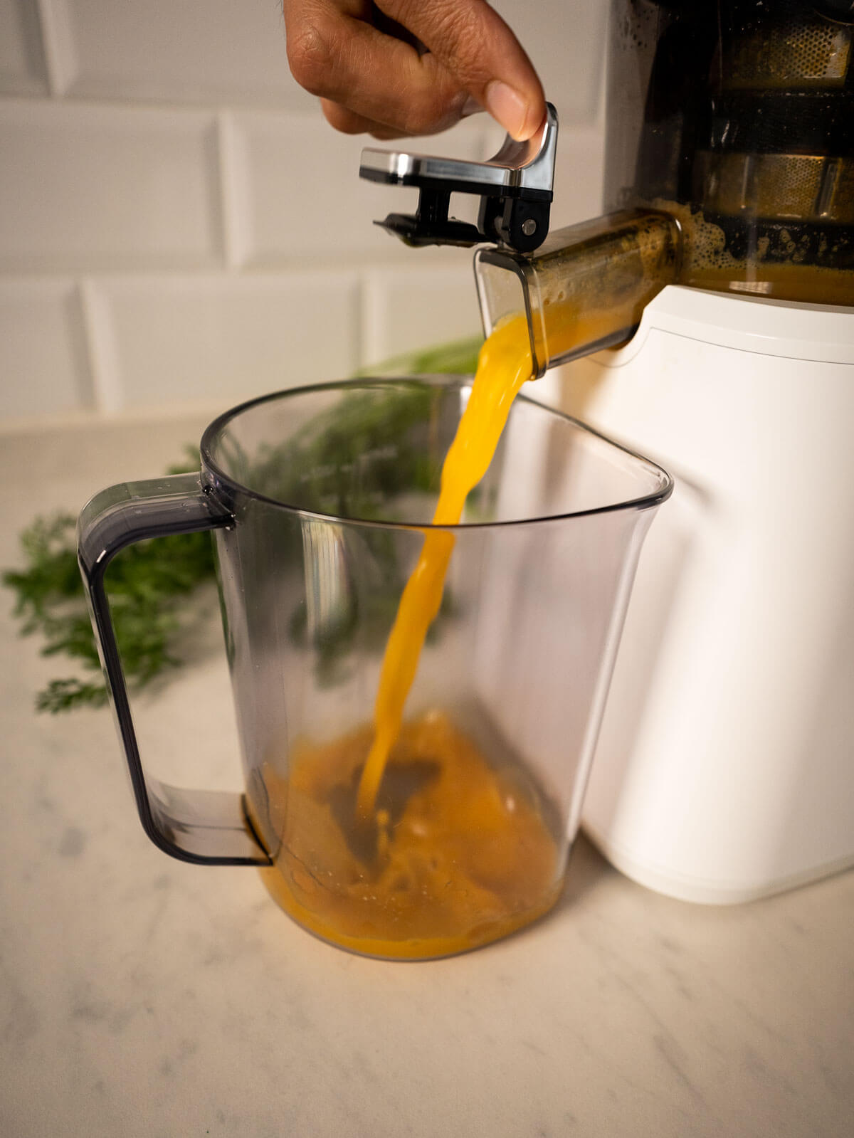 juice pouring from juicer.