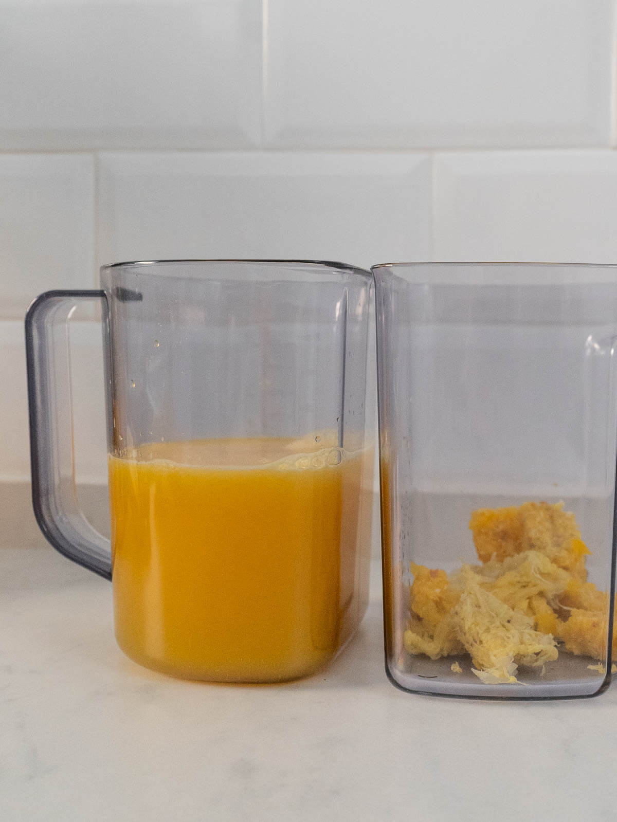 two jars, one with golden juice and the other with the pulp.