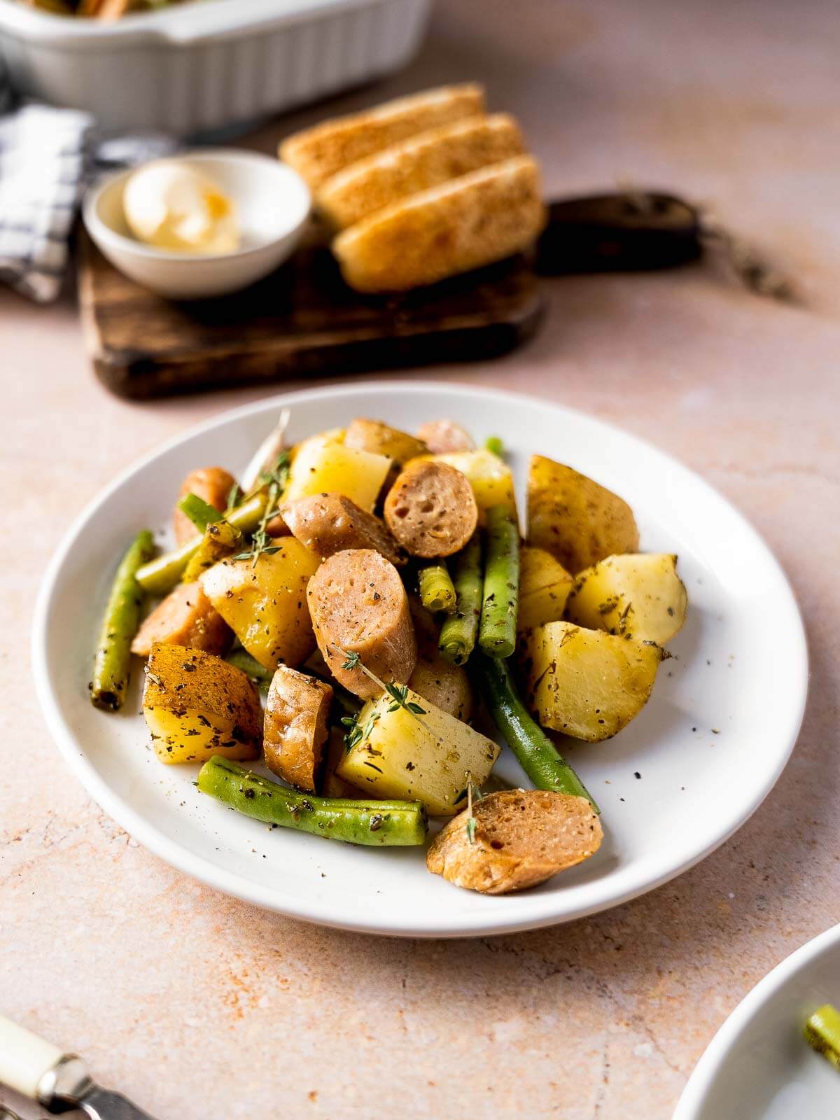 green beans with potatoes and sausage plated.